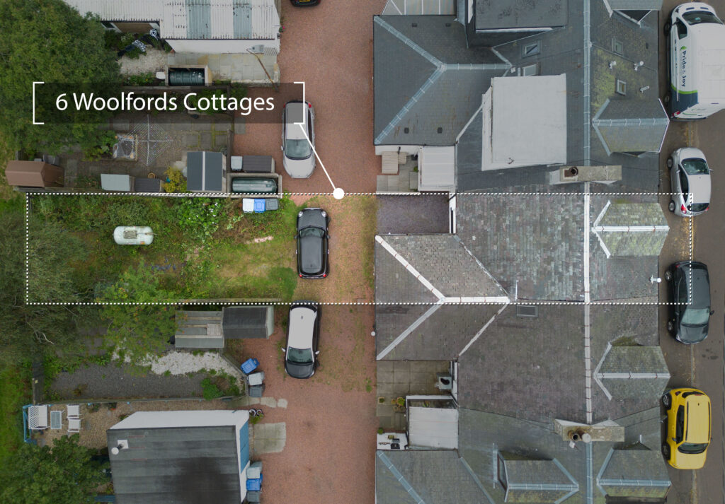 drone shot showing house roof and garden layout